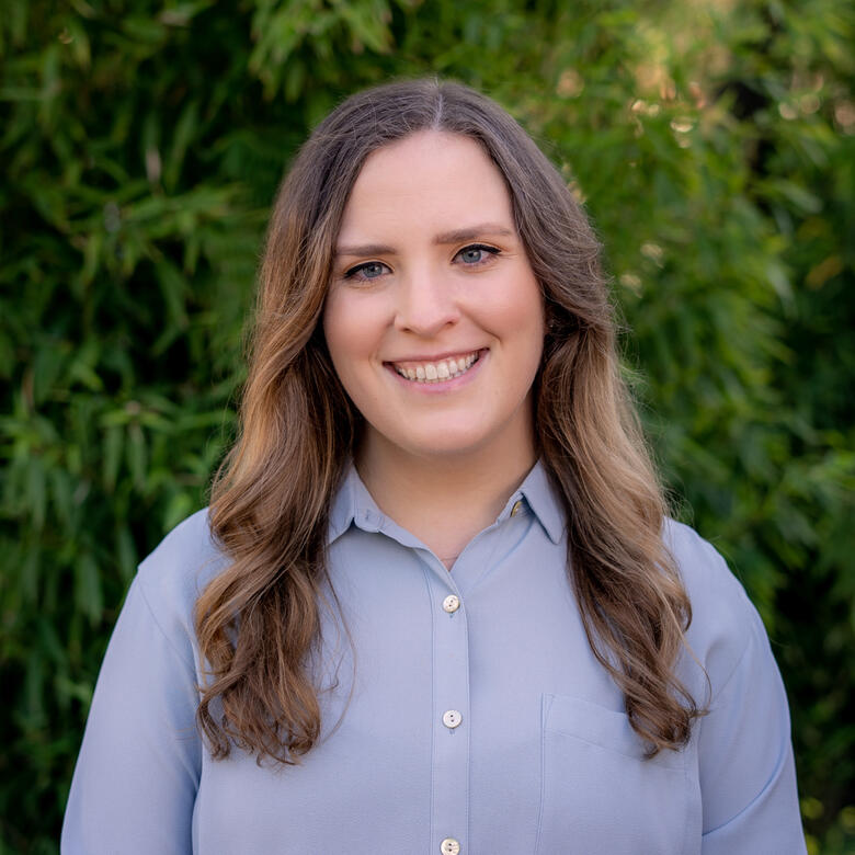 Image of Ashley Haylett wearing a blue collared blouse